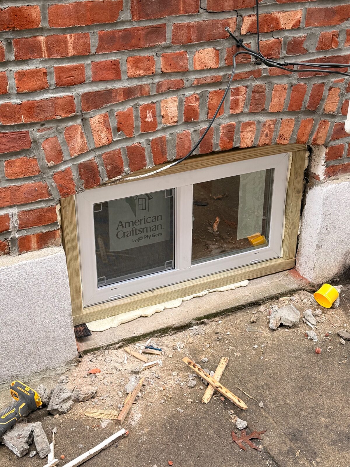 New ground-level window installed in brick property
