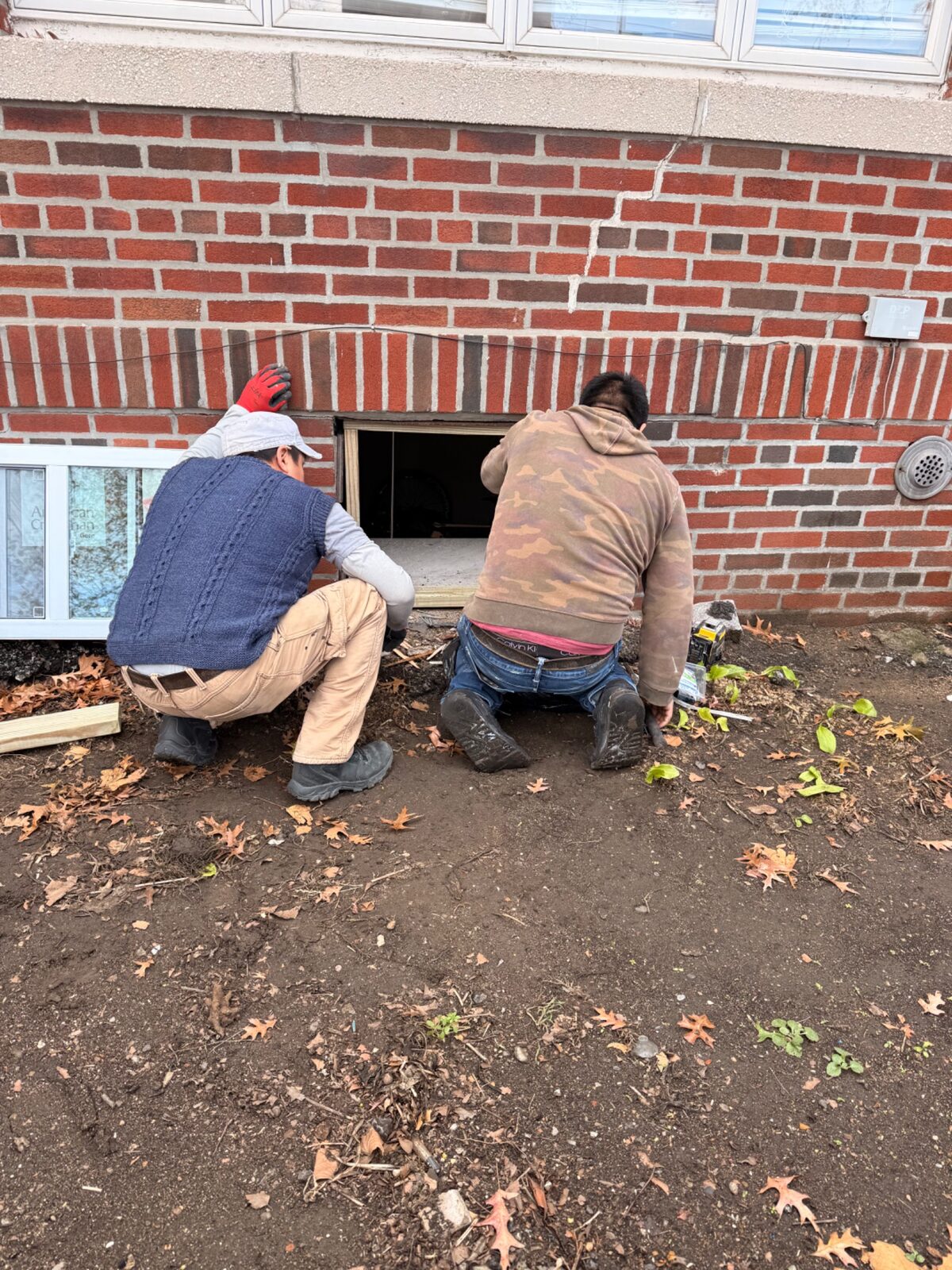 Property services crew completing window replacement