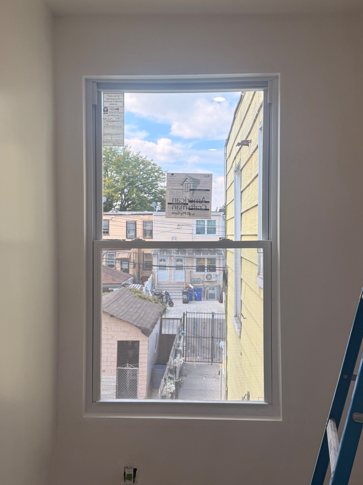 Newly installed apartment window with clean finished interior trim